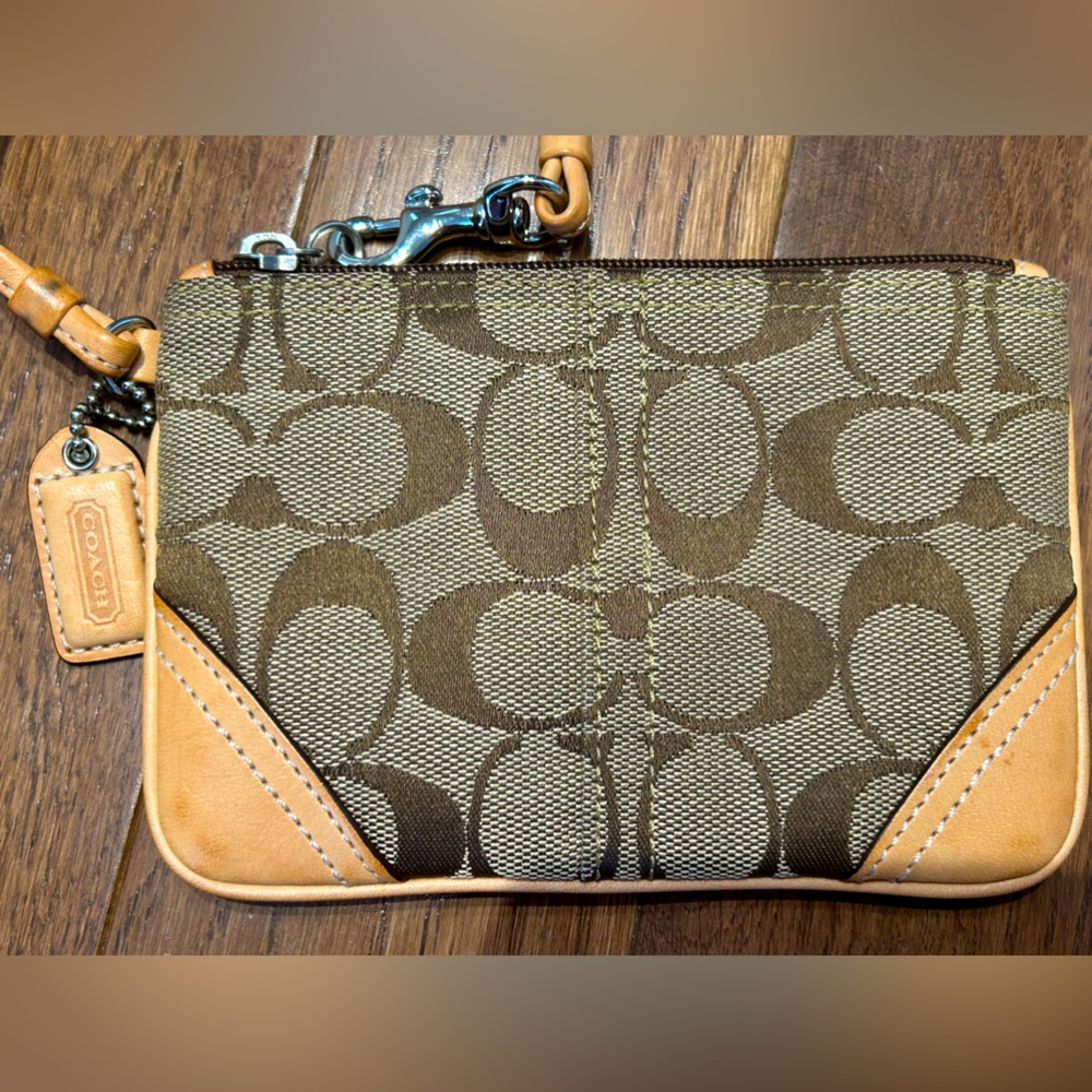 COACH zip wristlet Looks new! Signature fabric w/leather trim 4.25”tall 6”wide
